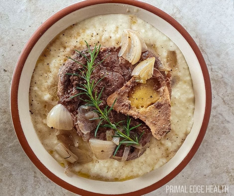 Beef shank slow cooker in a white and brown bowl.