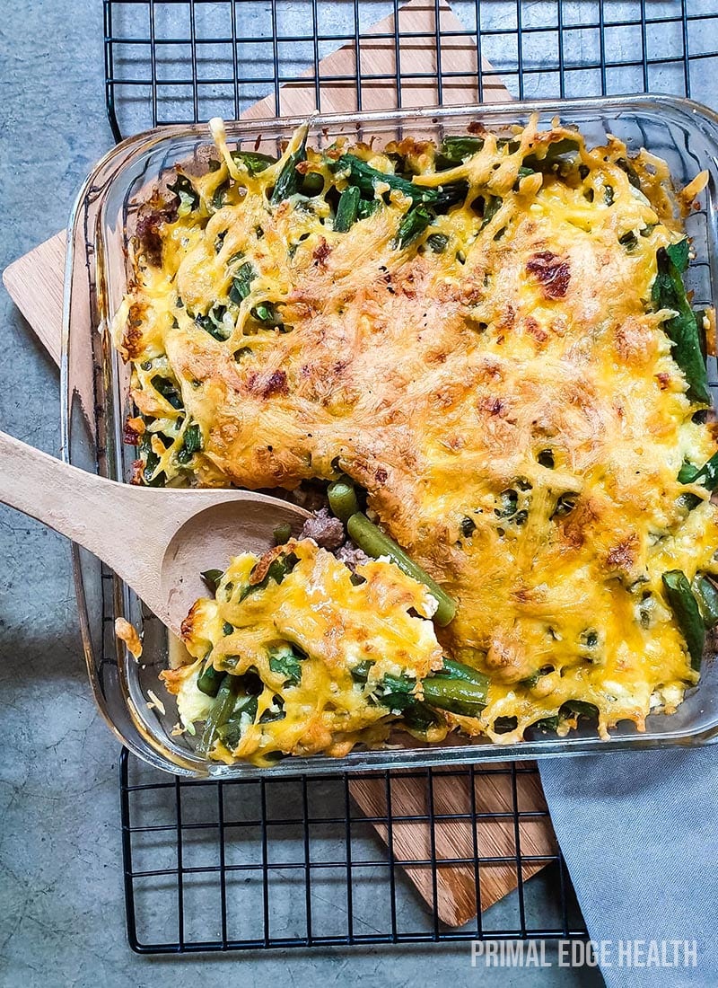 Green bean hamburger casserole served in a glass dish.