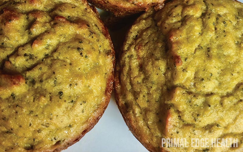 Two brown savory muffins.