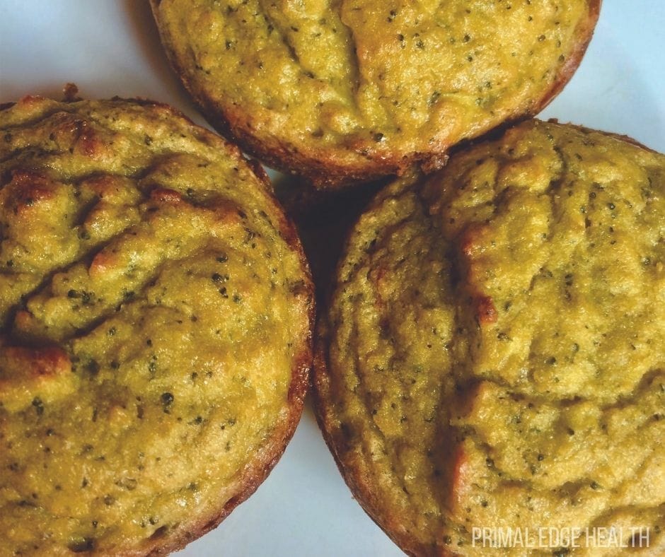 Pieces of savory muffins on a white surface.