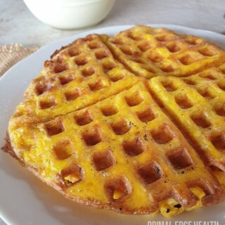 Carnivore waffle on a white plate.