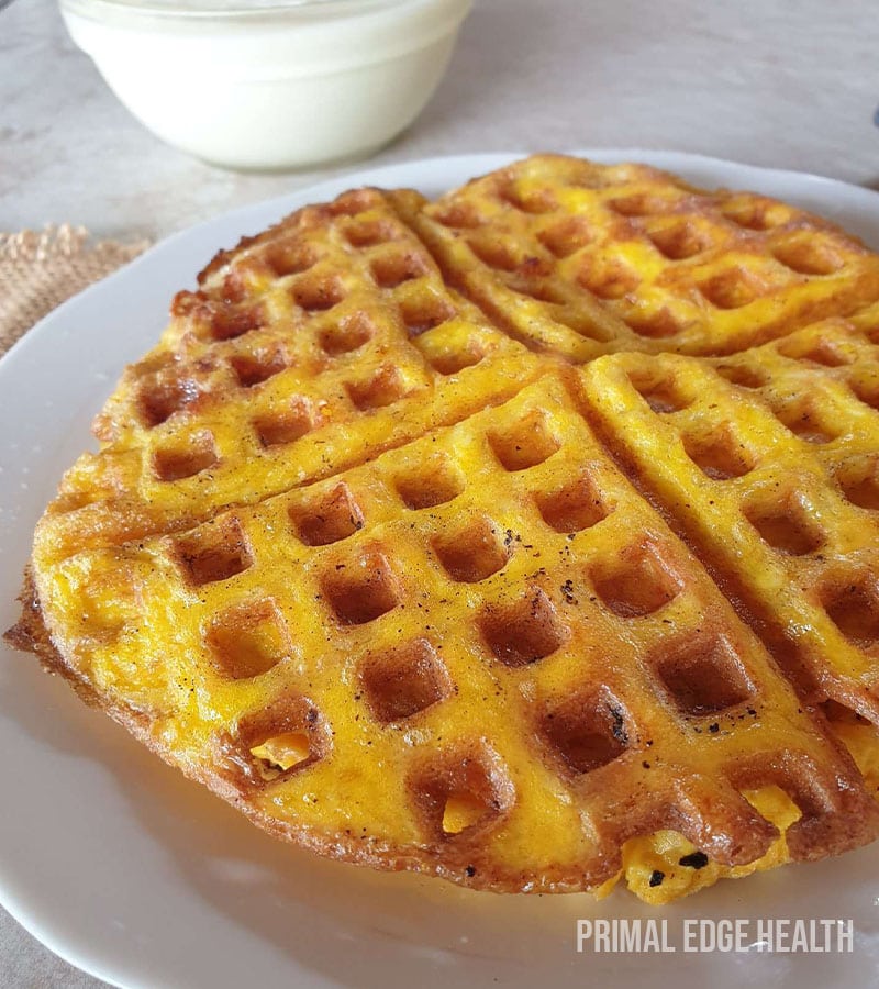 Carnivore waffle on a white plate.