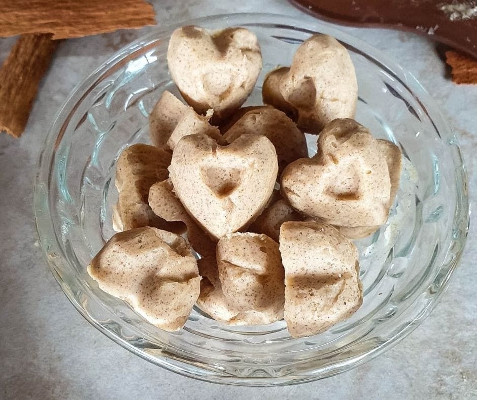Keto cinnamon fat bombs in a glass dish.