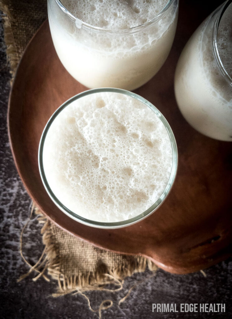 3 glasses of Chai Smoothie on a wooden board.