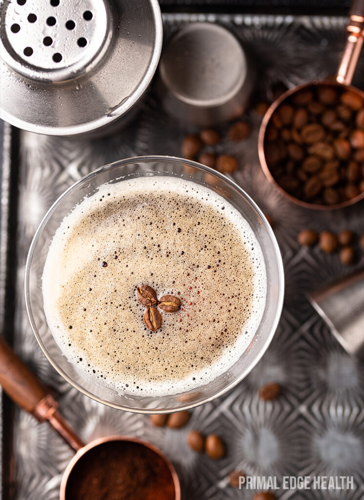 Glass of keto espresso martini with foam on top.