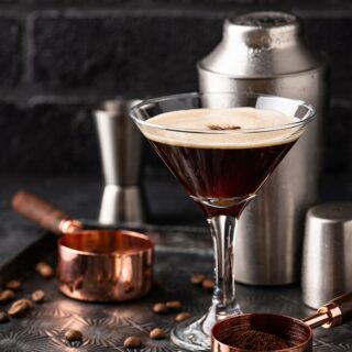 Espresso martini served in a stemmed glass.