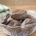 Keto peppermint patties in a glass bowl.