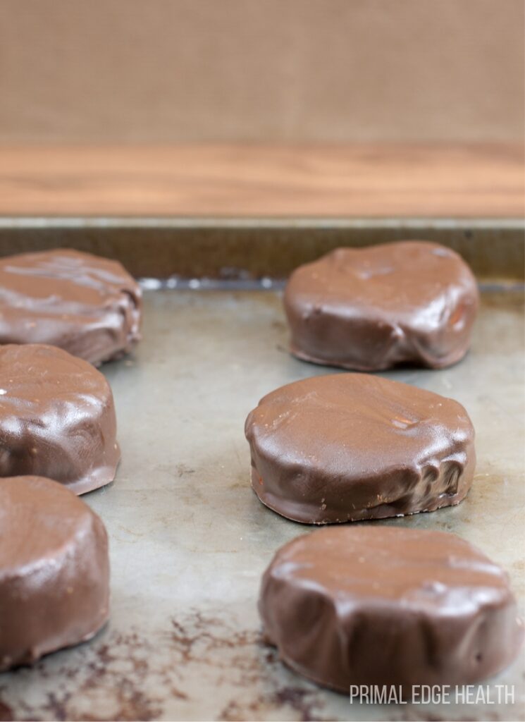Keto peppermint patties on a metal tray.