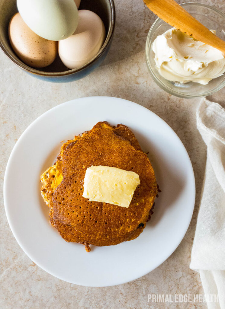 A stack of pancakes on a kitchen countertop.