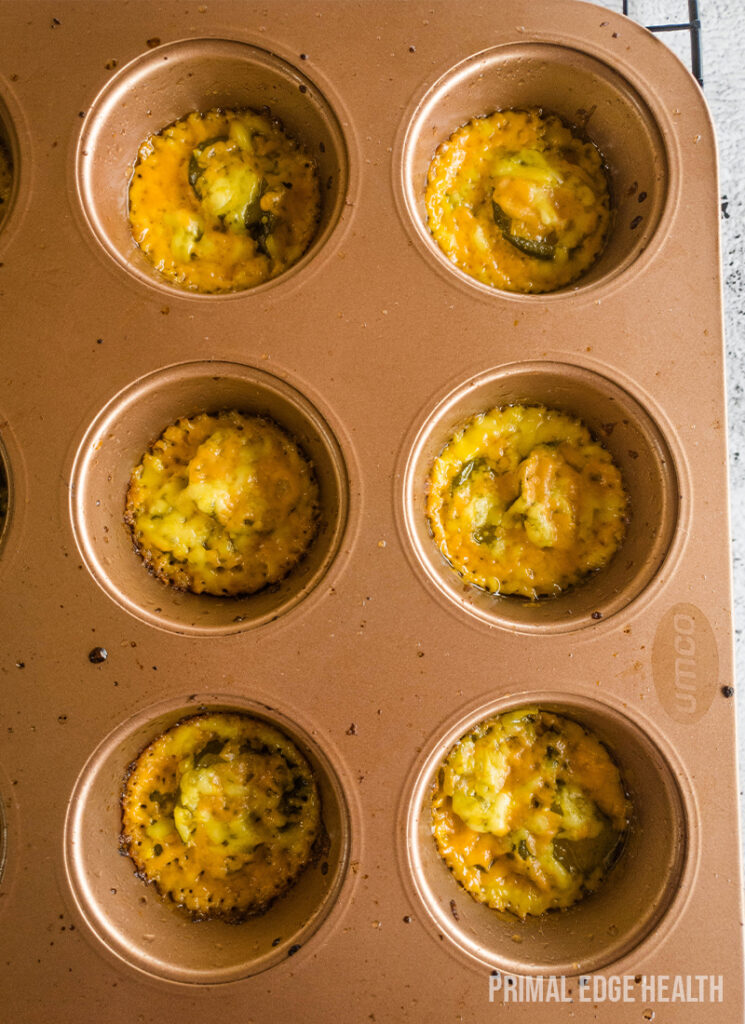 Muffins in a brown muffin tray.