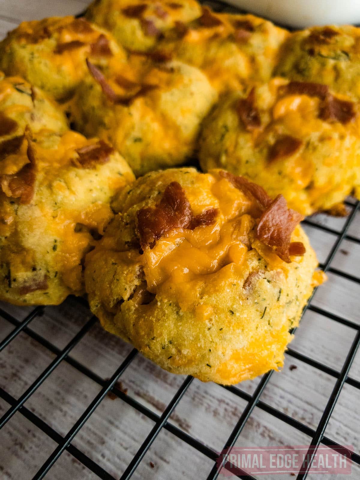 A bunch of keto crack biscuits on a wire rack.