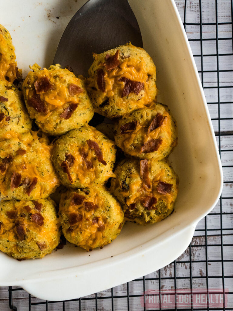 Keto crack biscuits in a serving dish with a spatula.