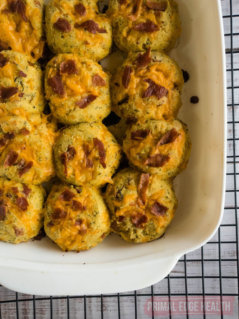 A tray of keto crack biscuits on a wire rack.