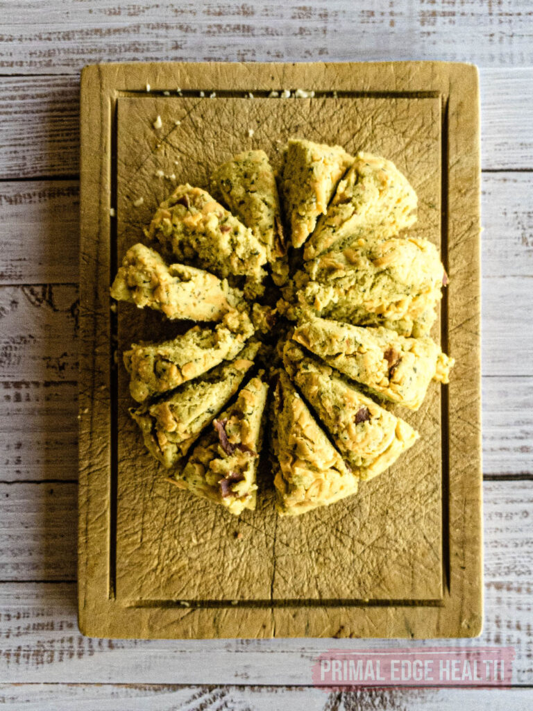 A tray of crack biscuits served on a wooden board.