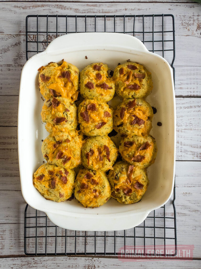 Crack biscuits cooling in a white baking dish.
