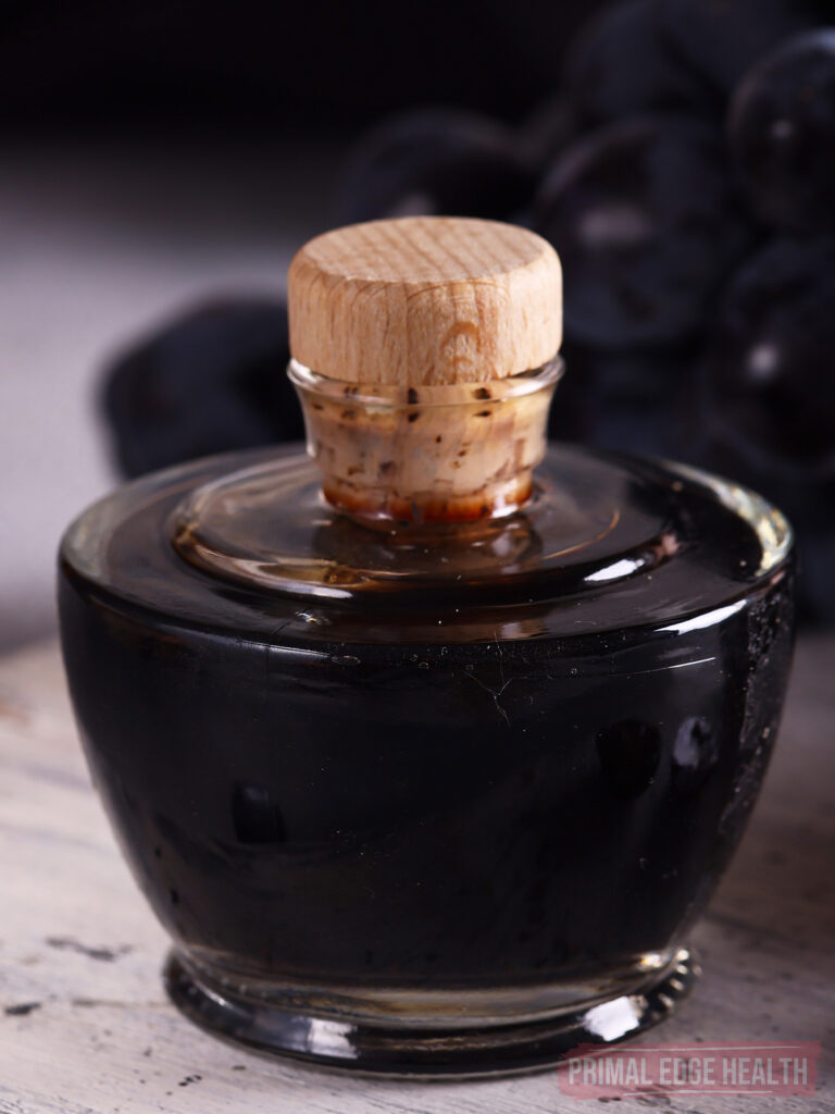 balsamic reduction in a glass jar with cork stopper