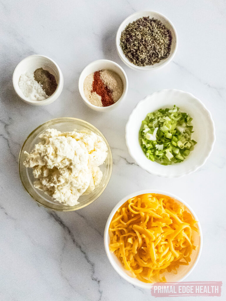 Small bowls with ingredients for keto cheese ball recipe.