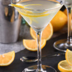 Keto vodka lemon drop martini in a glass with lemon twist.