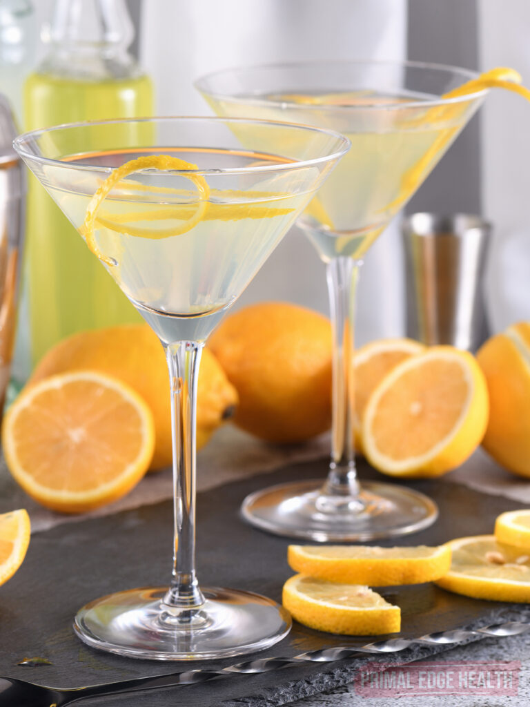 Two glass of keto lemon drop martinis garnished with lemon.