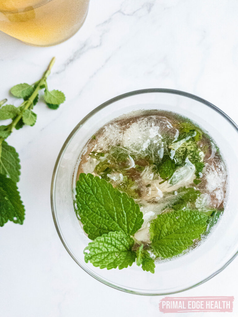 Keto mint julep in a glass, garnished with fresh mint leaves.