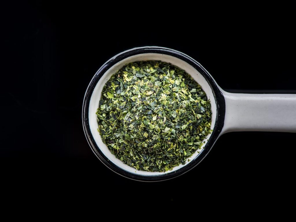 Seaweed flakes in measuring spoon