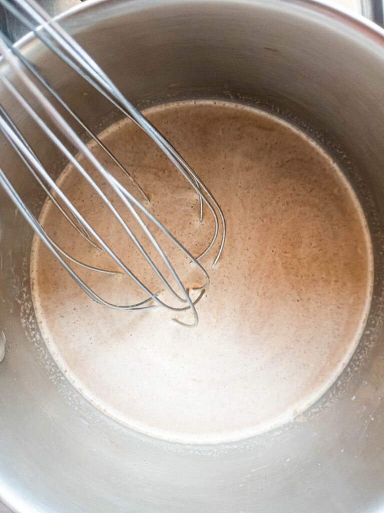 Whisking ingredients into ashwagandha coffee.