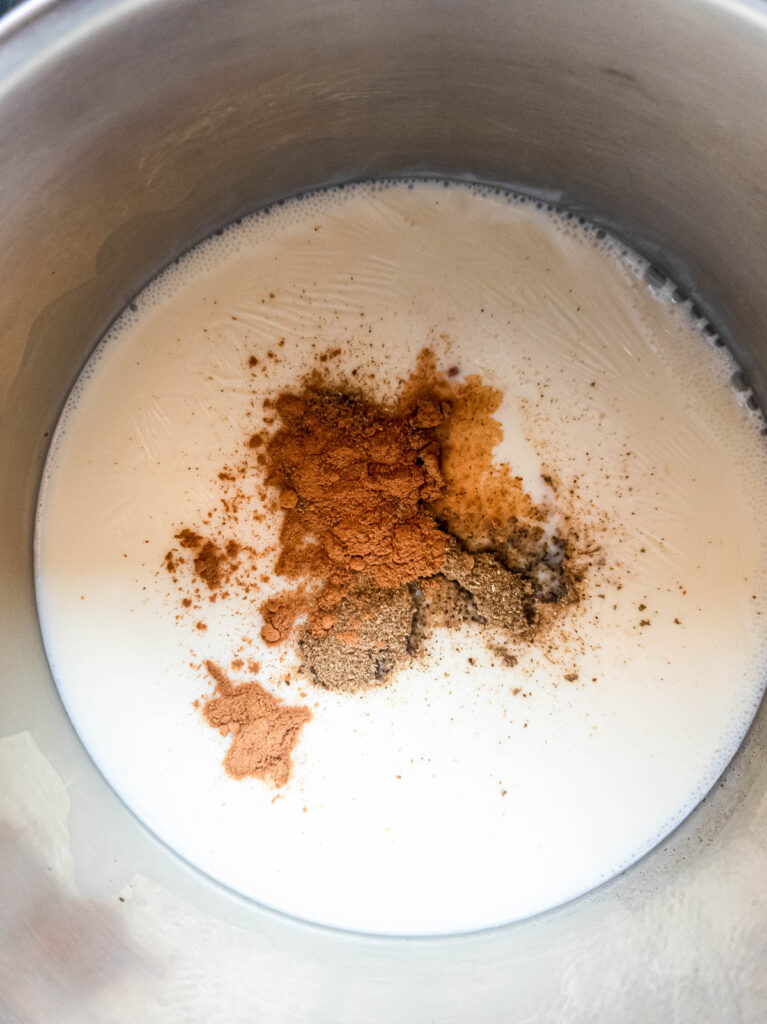 Warming milk and adding ingredients to the ashwagandha latte.
