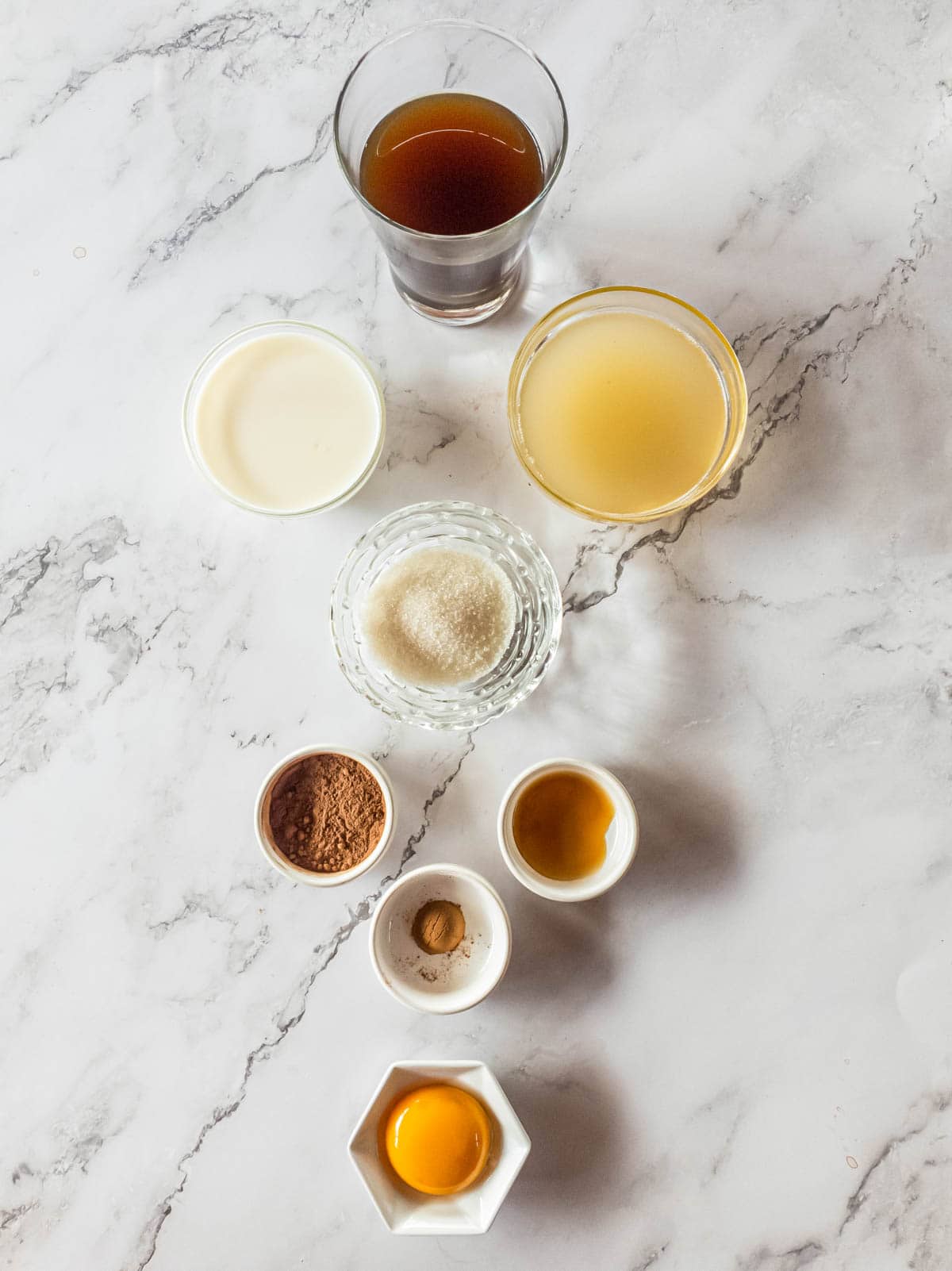 A picture of all the bone broth latte ingredients on marble background.