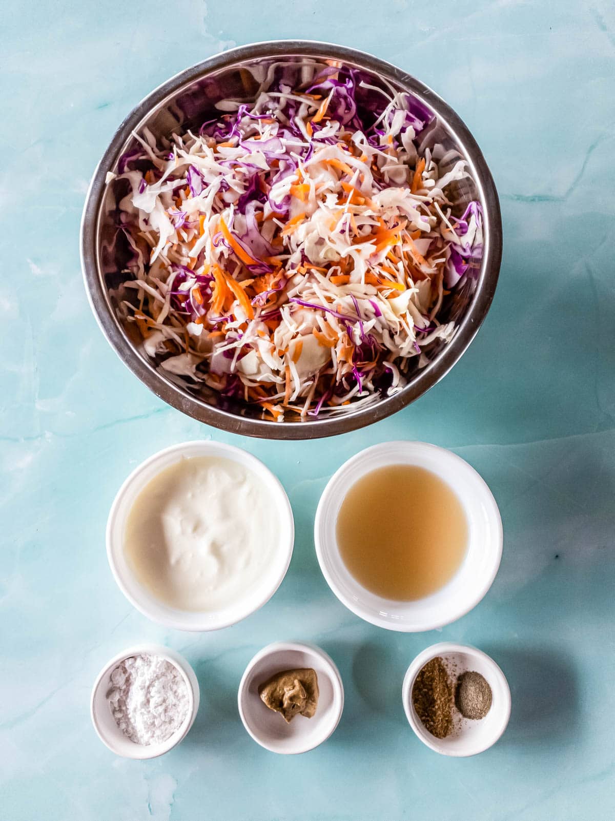 A picture of keto coleslaw recipe ingredients on blue background.