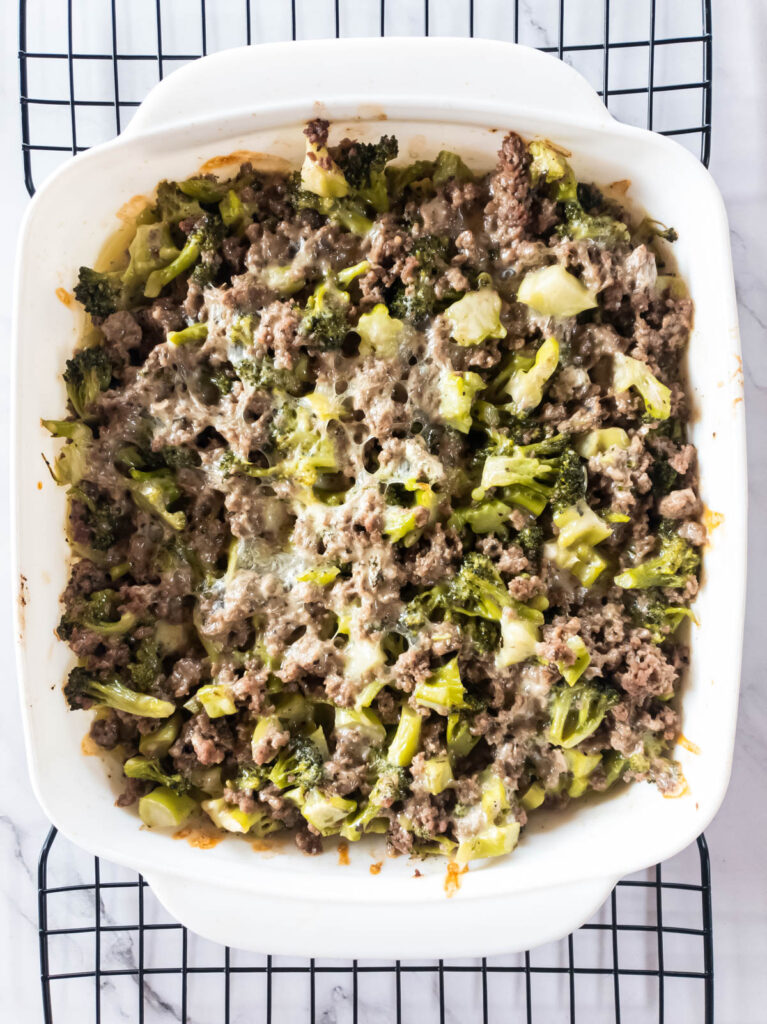 A casserole dish filled with baked broccoli and ground meat.