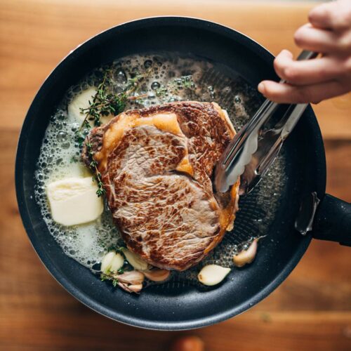 Learn how to reverse sear a steak by frying it in a pan.