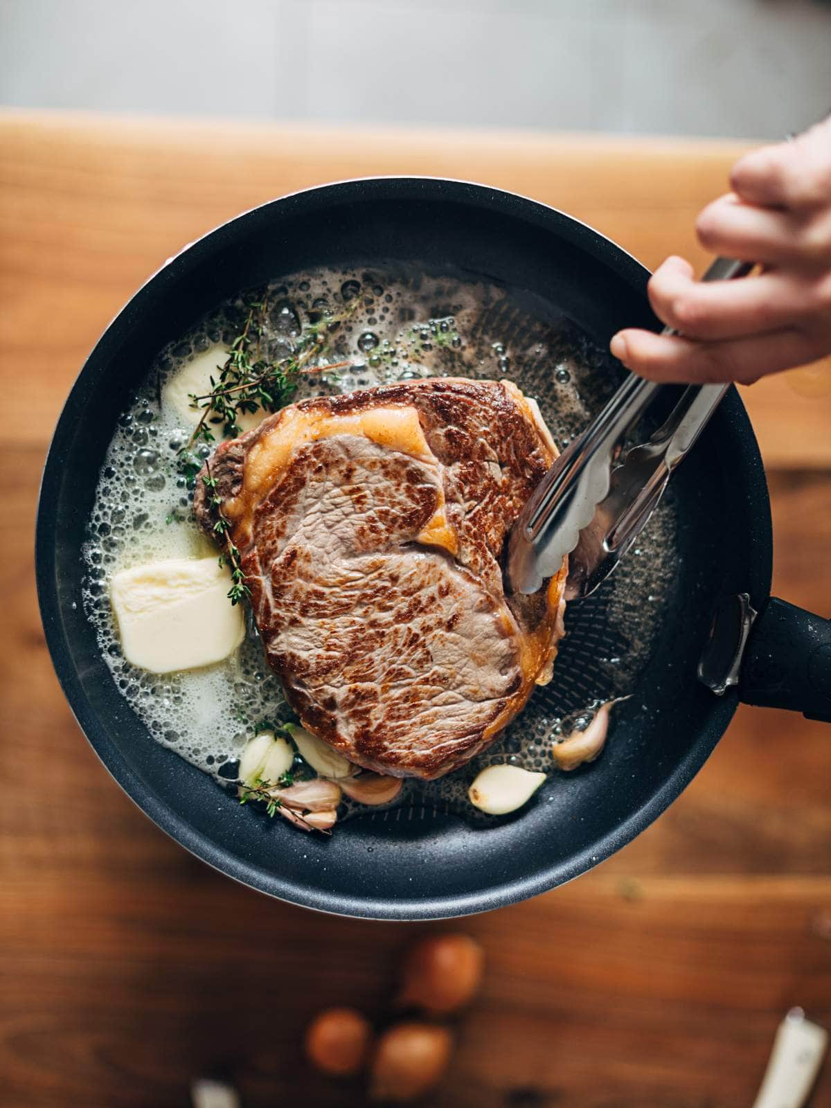 Learn how to reverse sear a steak by frying it in a pan.