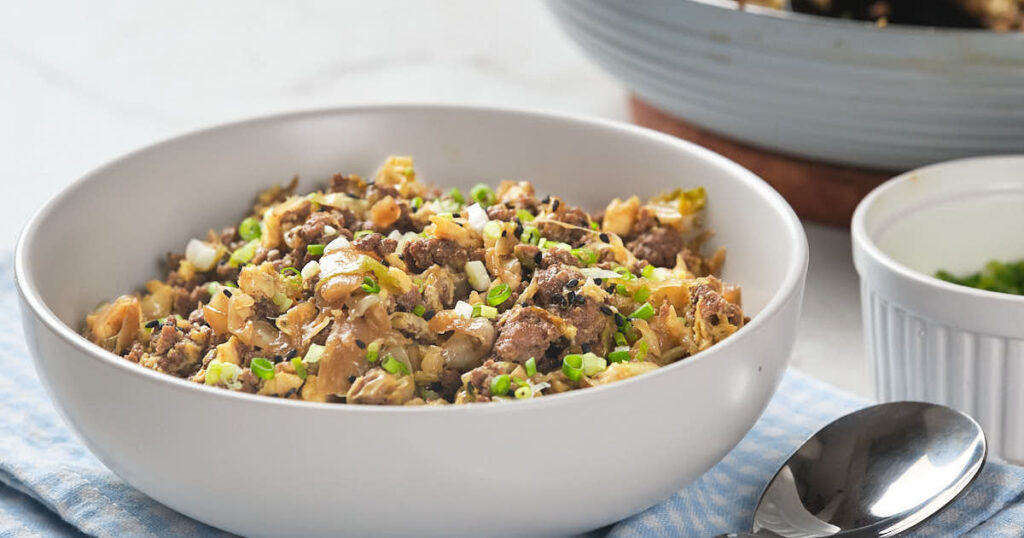 A white bowl filled with egg roll in a bowl recipe.