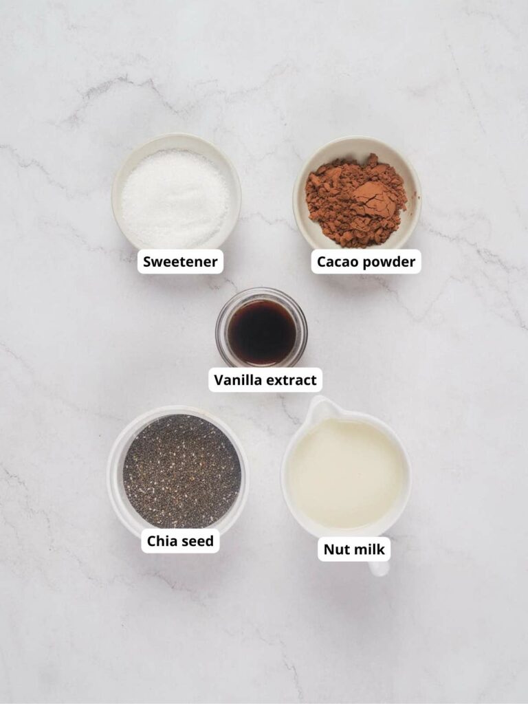 Five labeled bowls containing ingredients for low carb chia pudding.