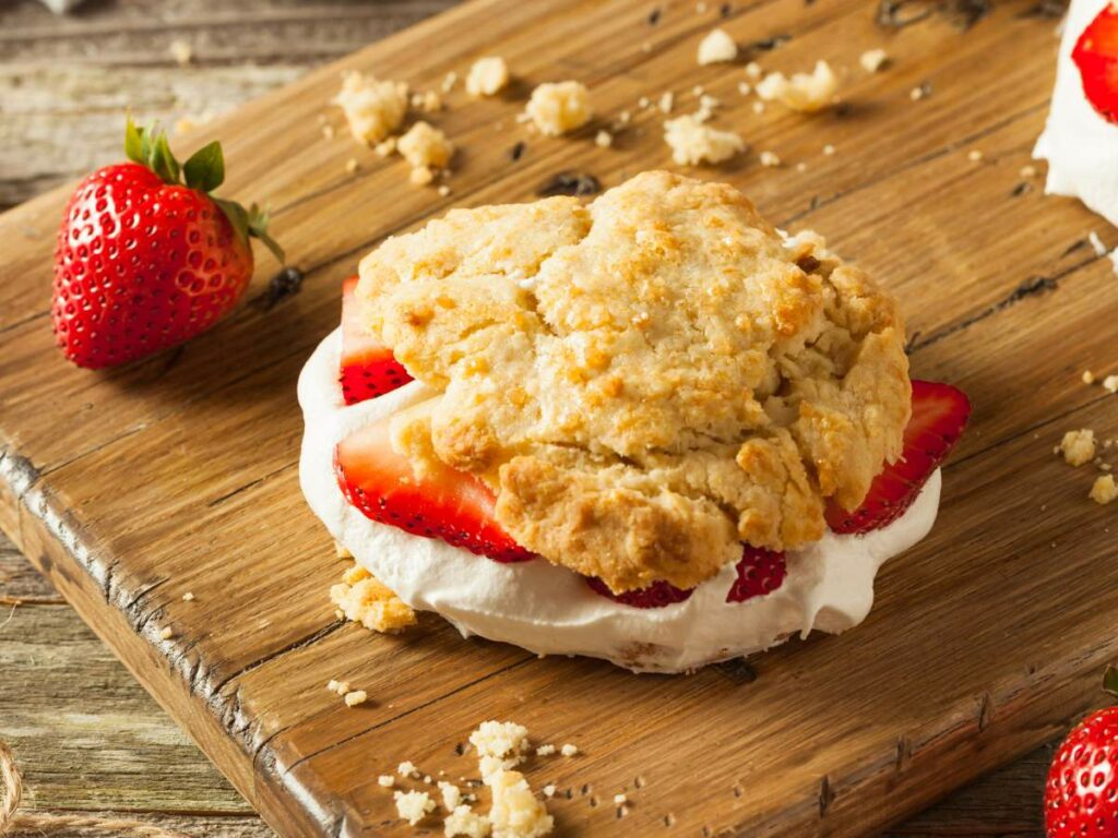 A strawberry shortcake with fresh strawberries and whipped cream.