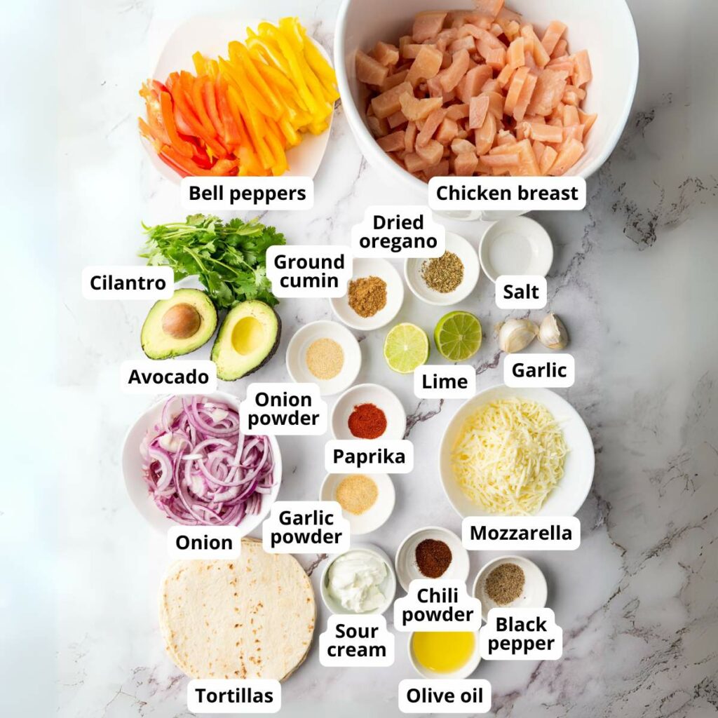 Assorted ingredients for making chicken fajitas are arranged on a white colored surface.