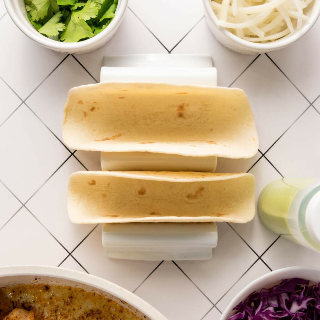 Two empty taco shells sit in a holder.