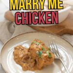 A plate with a serving of creamy, saucy chicken garnished with herbs and a fork, with bold text reading "Flavorful & Creamy Marry Me Chicken.