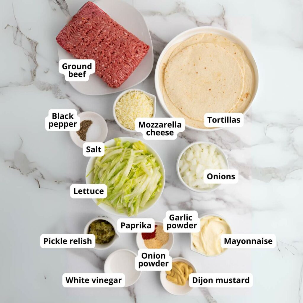 A selection of labeled ingredients on a white marble surface.