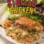 A plate with herb-stuffed chicken breast, garnished with chopped parsley, served with fresh mixed greens.