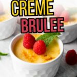 A white ramekin of creme brulee topped with raspberries and a mint leaf, with text reading "Easy 5-Ingredient Creme Brulee" and "primaledgehealth.com.
