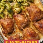 Baked chicken thighs and roasted broccoli with onions arranged on a sheet pan, viewed from above, with text overlay that reads "Flavor-Packed Sheet Pan Chicken Thighs.