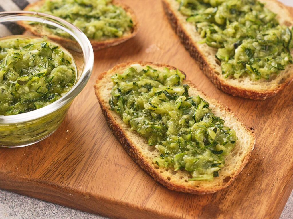 Toasted slices of bread topped with a zucchini butter.