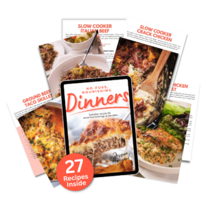 An arrangement of printed recipe pages and a tablet displaying the cover of "No-Fuss Nourishing Dinners: 27 Recipes Inside" by Jessica, showcasing casserole and skillet dishes—perfect for anyone who loves discovering new cookbooks.